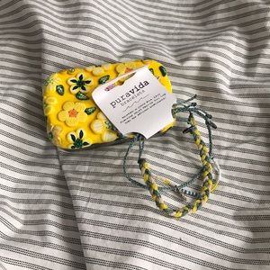 Yellow and blue Pura Vida bracelets.